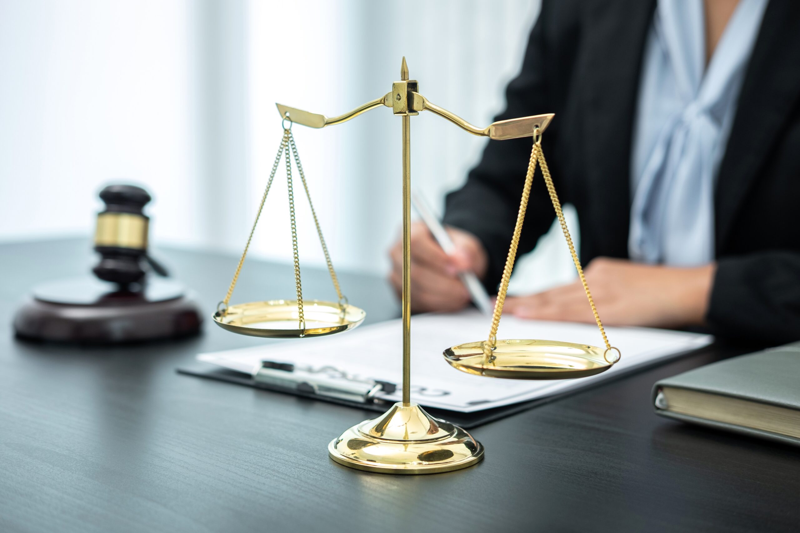 Female lawyer working with legal case document contract in offic